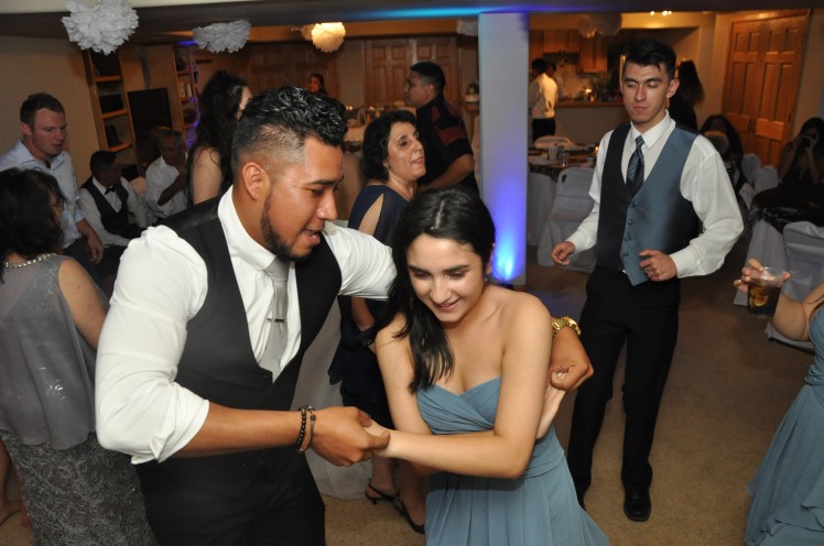 Everyone young and old having a great time dancing at this hispanic wedding in Castle Rock Colorado