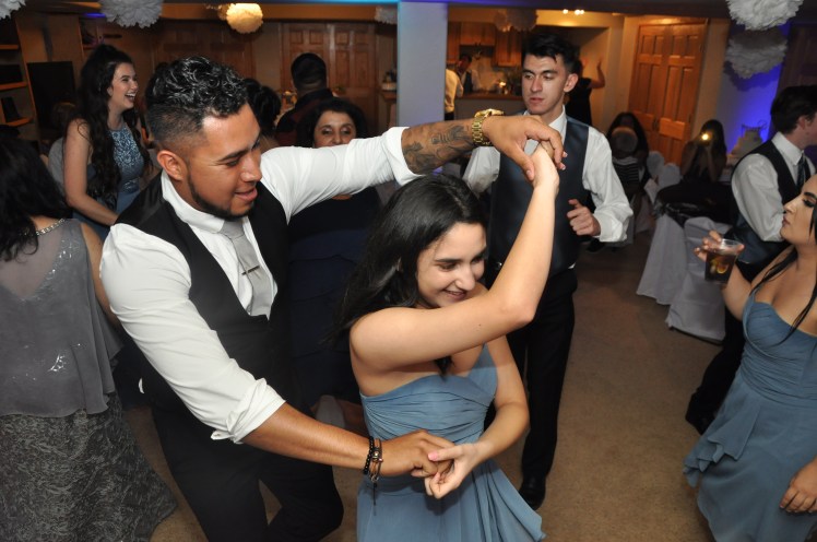Everyone young and old having a great time dancing at this hispanic wedding in Castle Rock Colorado