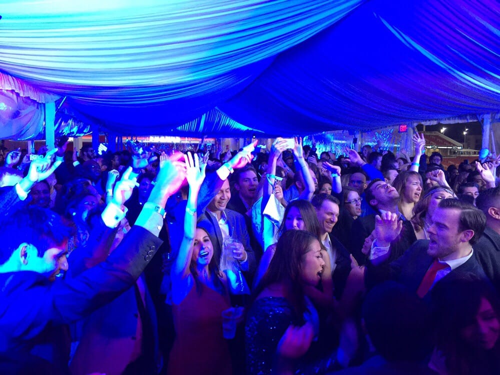 Denver corporate party djs under tent blue dj lighting people having fun