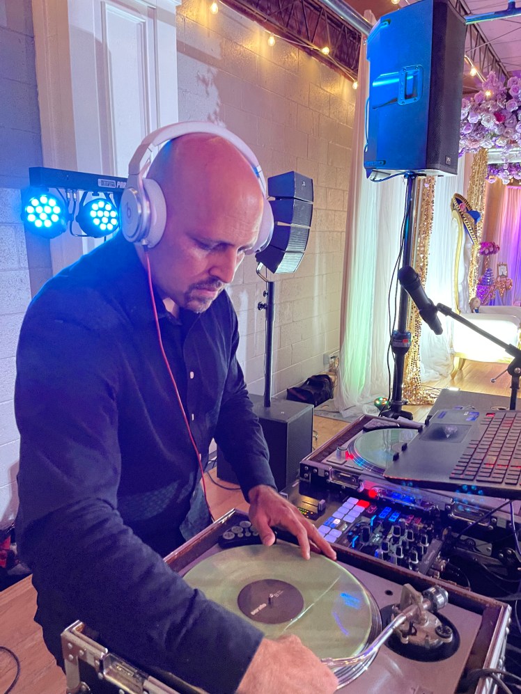 DJ Emir of Denver's Best DJs Deejaying for Maya's Quinceañera in Denver Colorado with Sound system turntables and lighting